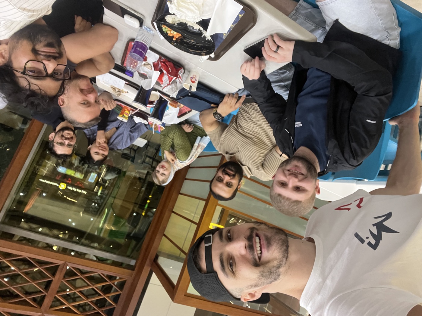 WorldXpat friends taking a selfie around a dinner table