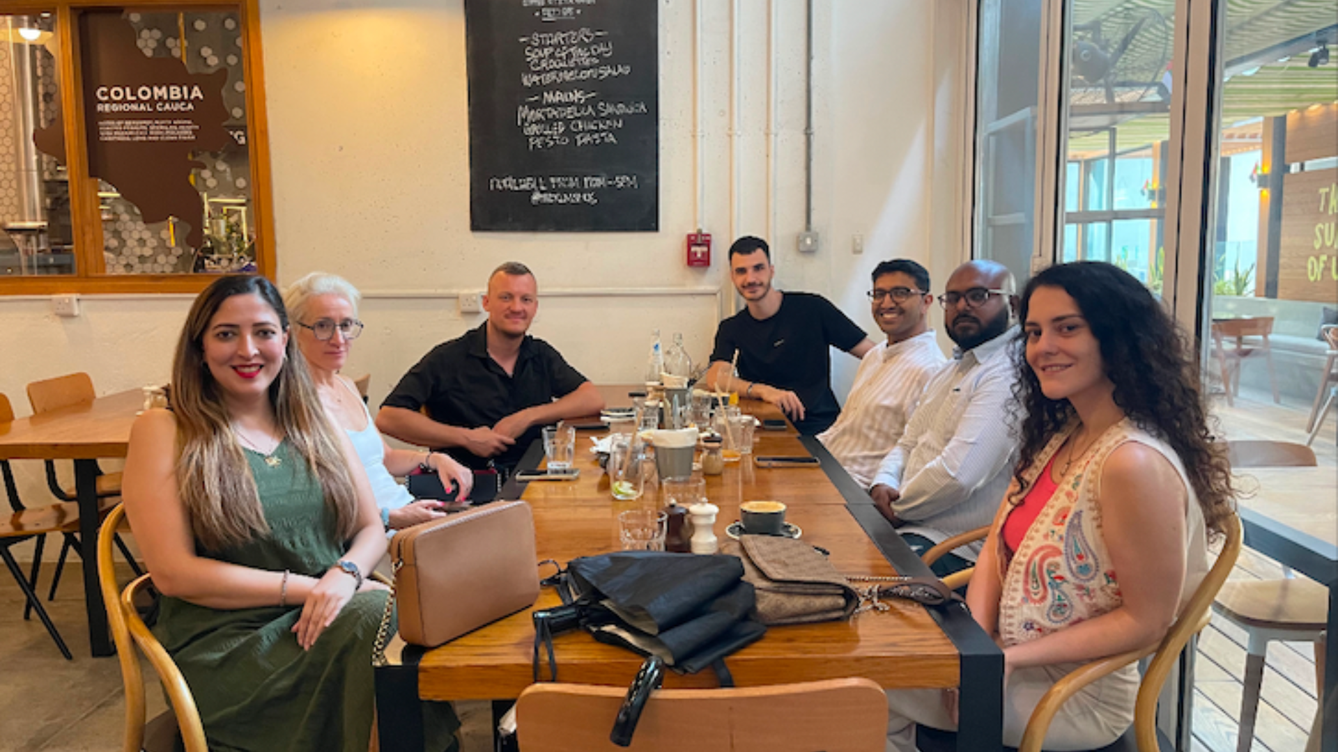 WorldXpat members gathered around a café table